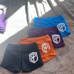 Set of 4: Born Primitive Women's Athletic Shorts - Black, Orange, Purple, Blue